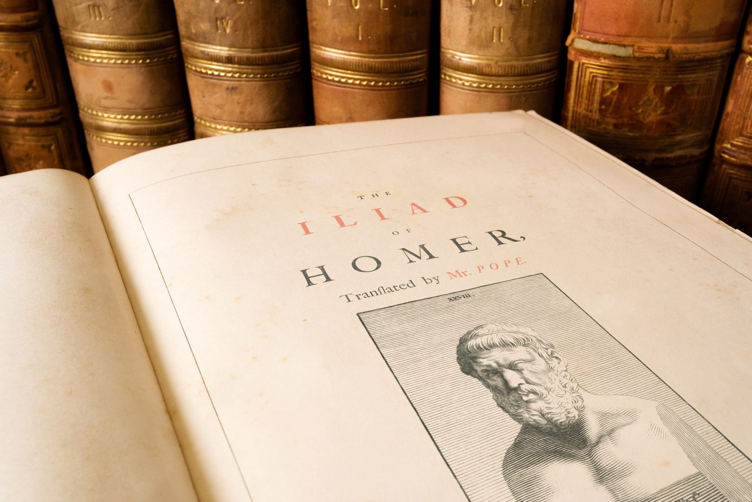 Antique copy of the Iliad by Homer, an epic ancient Greek poem. Set during the Trojan War, the ten-year siege of the city of Troy (Ilium) by a coalition of Greek states, it tells of the battles and events during the weeks of a quarrel between King Agamemnon and the warrior Achilles..