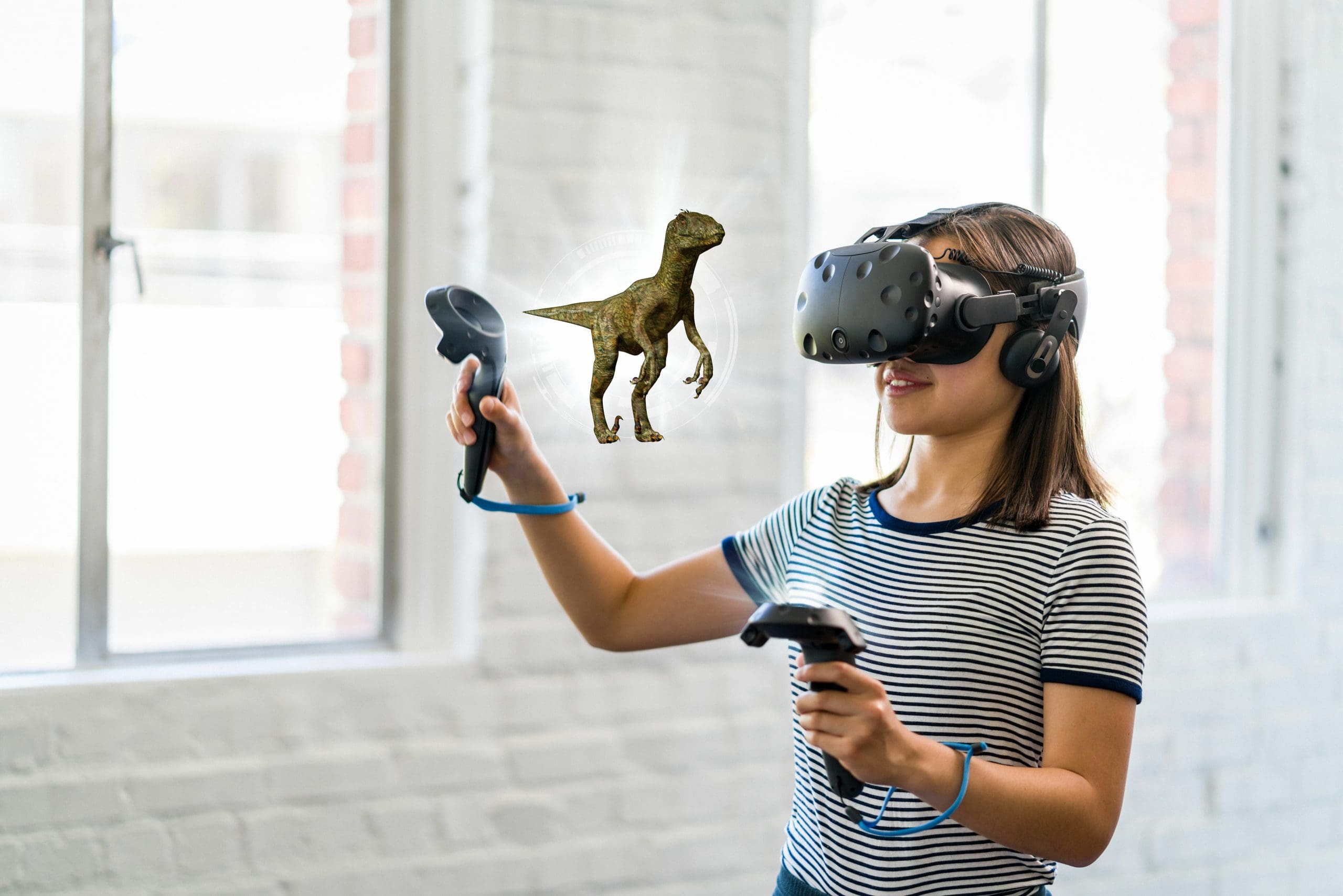 A teenage student wearing a virtual reality headset to study science.